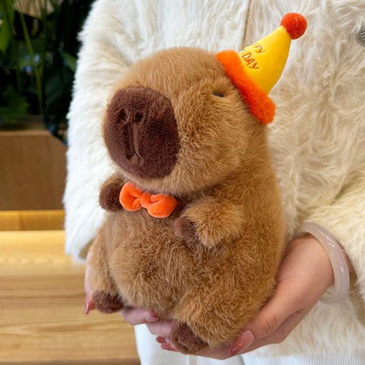 Capybara con sombrero de feliz cumpleaños