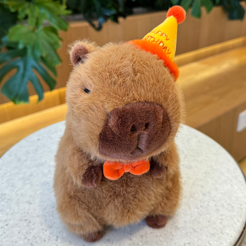 Capybara con sombrero de feliz cumpleaños