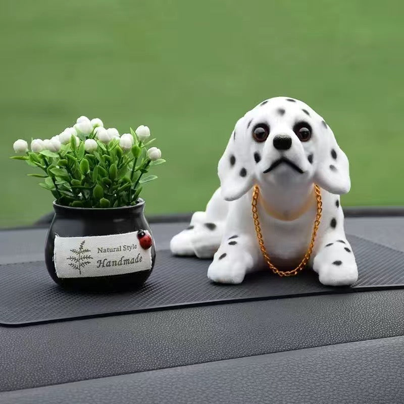 Muñeca perro para coche
