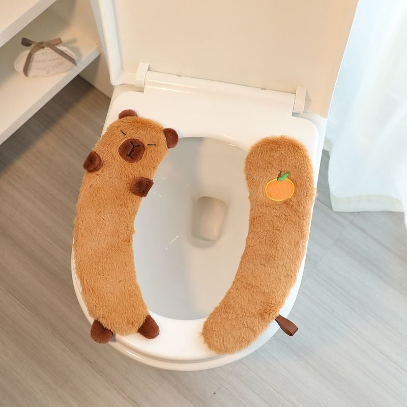Asiento capybara del baño